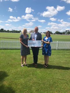 Major Richard Carney presenting the cheque to the The Shakespeare Hospice