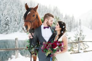 winter weddings - photo with horse and snow back drop